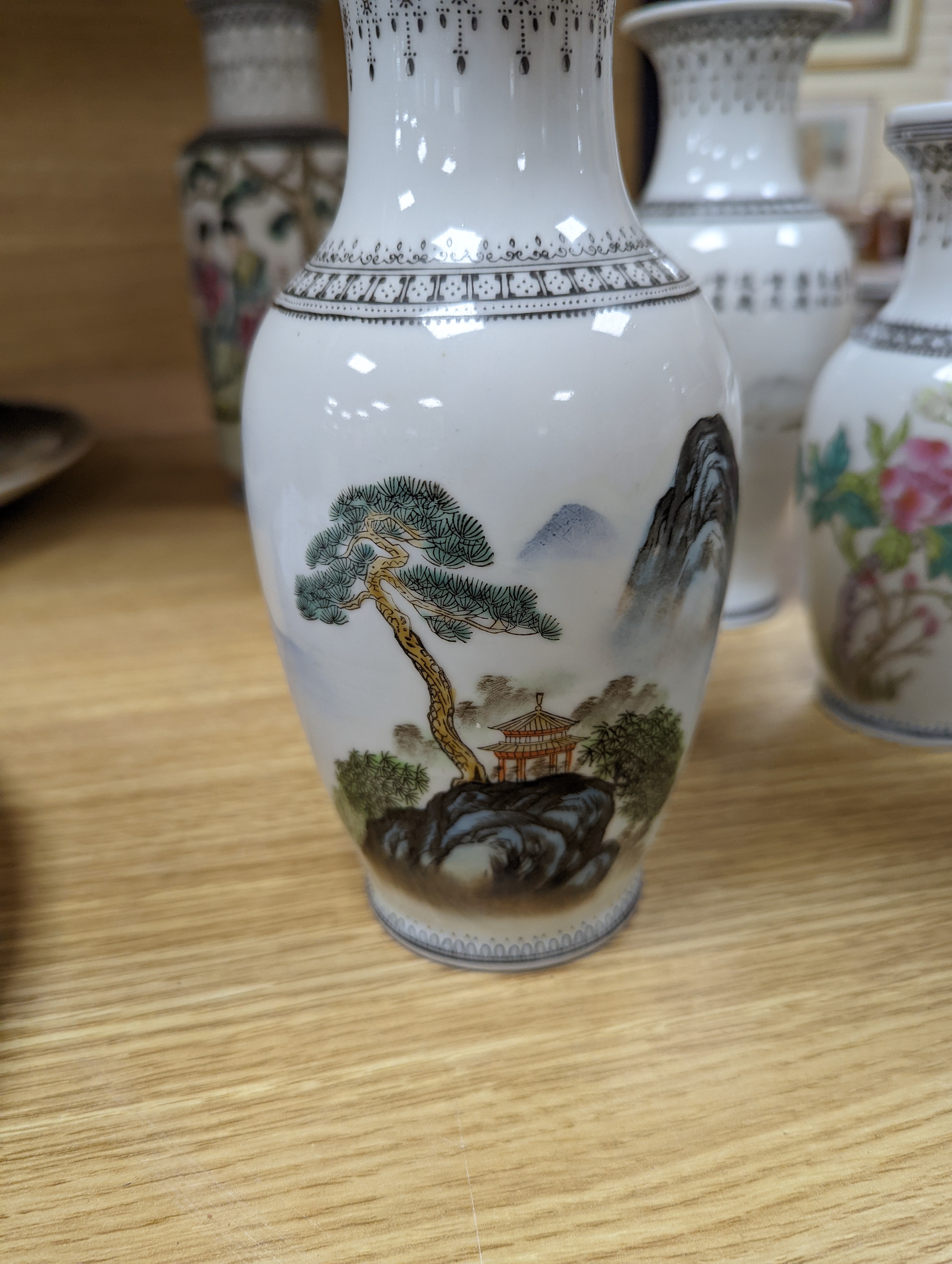 A group of seven Chinese famille rose vases, 20th century